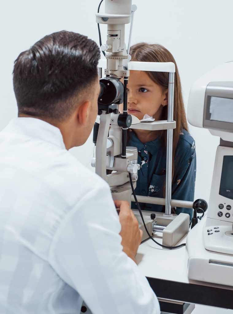 young-ophthalmologist-is-with-little-female-visitor-in-the-clinic.jpg